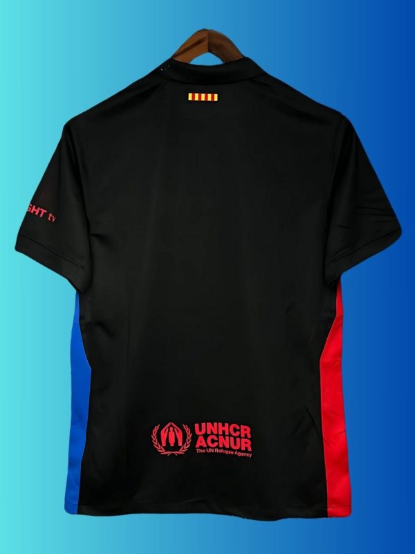 2024 Barça away kit in black with red-blue gradient crest