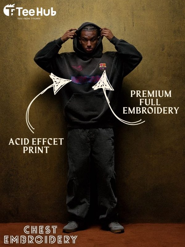 Close-up of hoodie sleeve with embroidered Travis Scott tag