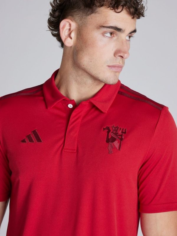 Limited edition red polo with Manchester United crest and Snapdragon logo