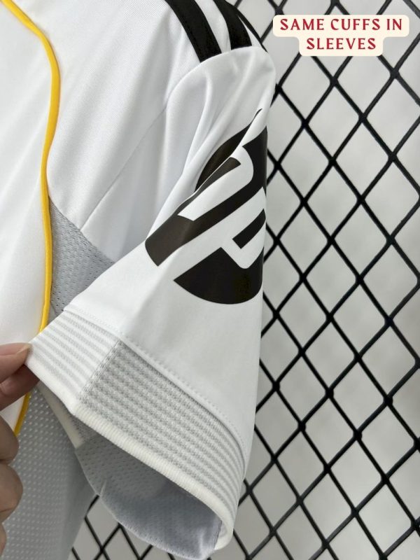 Close-up of the Real Madrid 25/26 jersey badge and embroidered details. real madrid jersey teehub