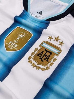 Sky blue Argentina World Cup 2026 football jersey from Teehub laid flat.